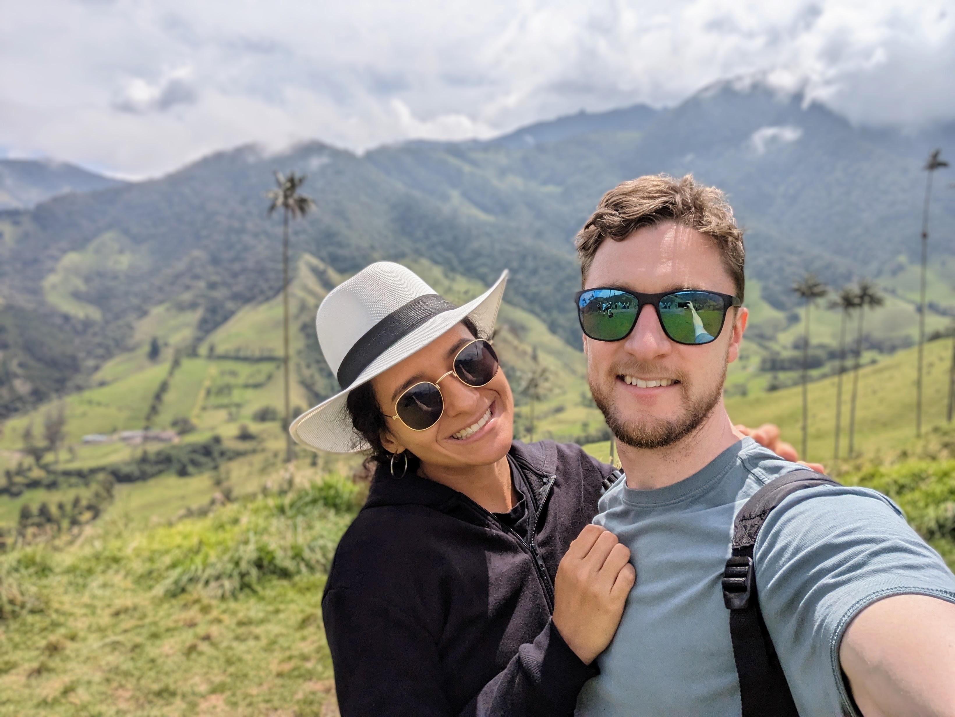 Person learning Spanish online with laptop and coffee